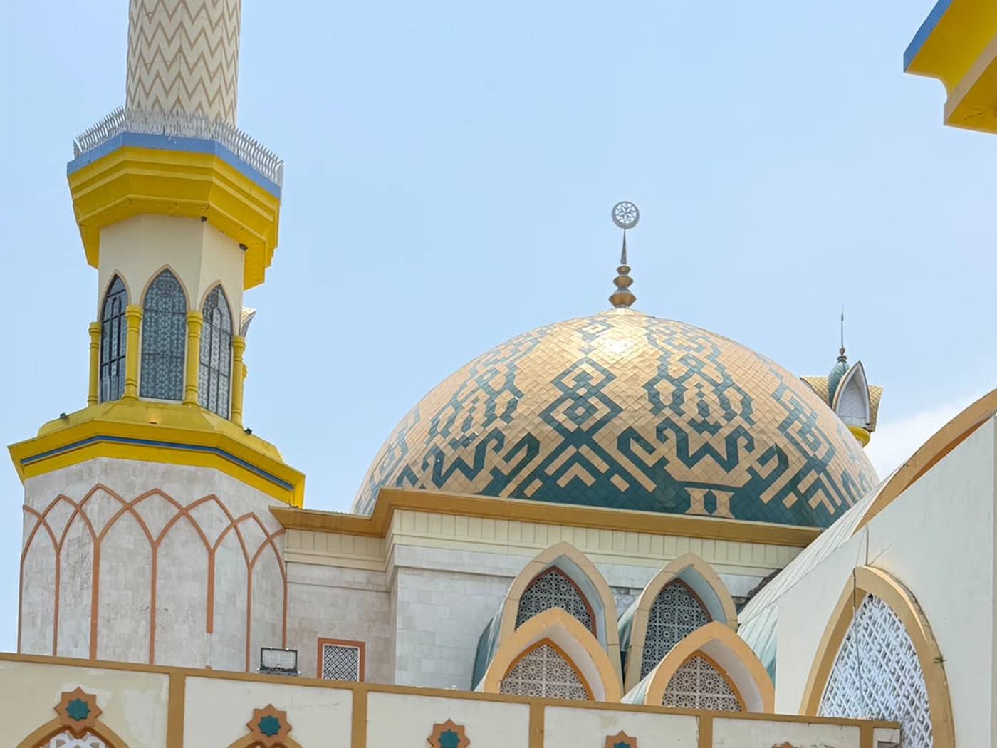 The Islamic Center in Mataram, Lombok: its patterned dome and minaret seen from the forecourt.