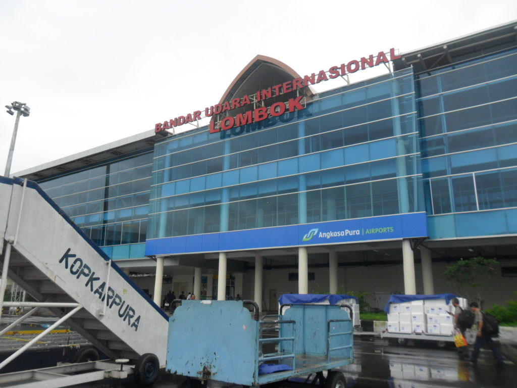 The terminal building of Lombok International Airport, its name lettered across the glass facade.